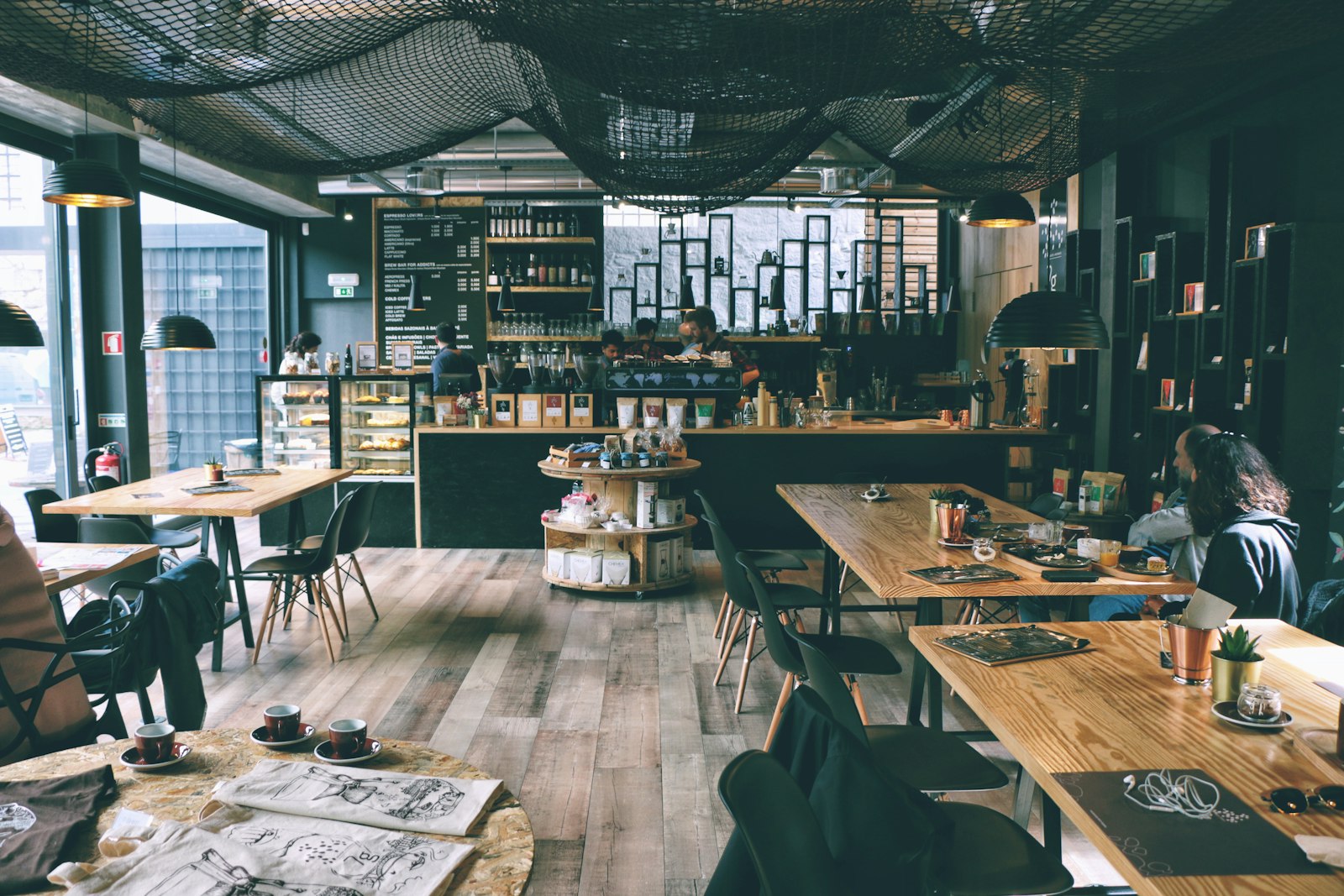 Warm specialty coffee shop interior with espresso bar